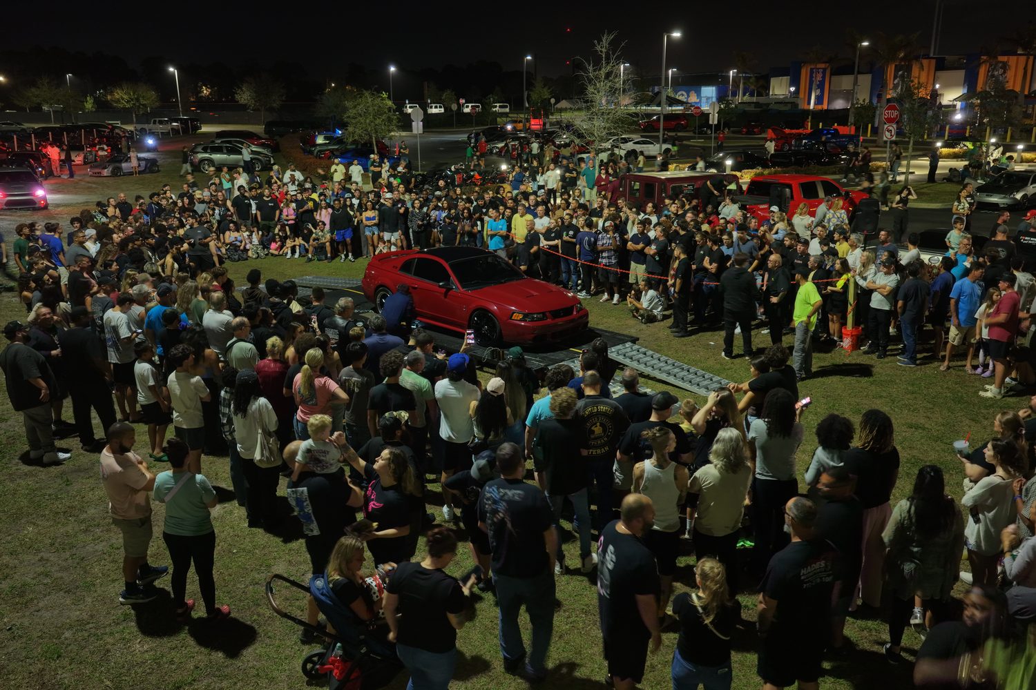 Guests gathered around a featured vehicle at a Shift Culture event